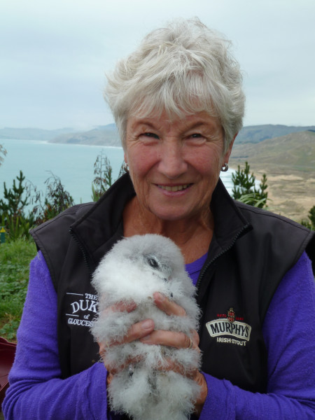 Liz Carter (Old Blue winner) holding a fluffy baby seabird