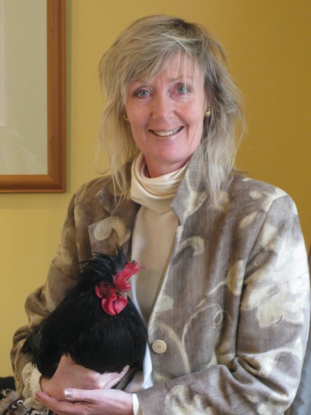 Writer Jane Berney holding a chicken profile pic. Image supplied