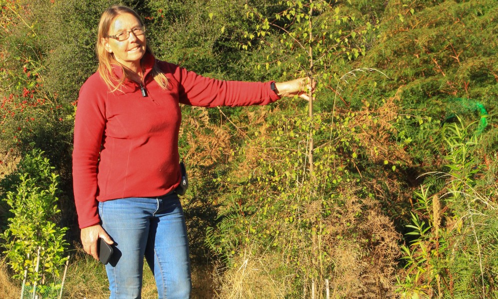 Anne Steven with one of the new plantings. Image Mo Turnbull