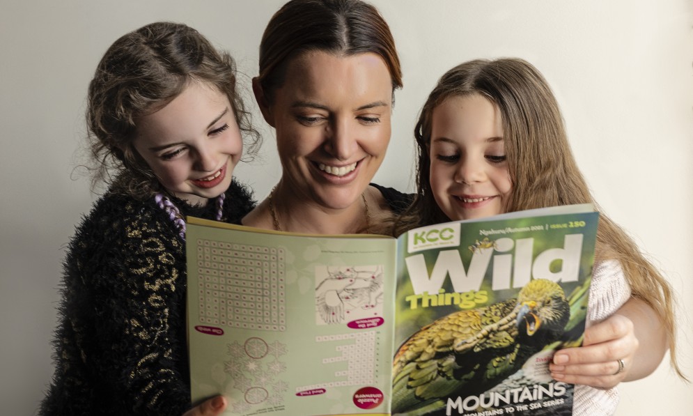 Family reading Wild Things magazine