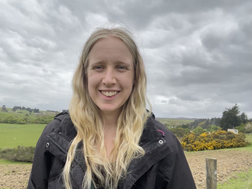 Gemma Marnane, co-director Forest & Bird Youth with the Takitimu Mountains behind her. Image supplied.