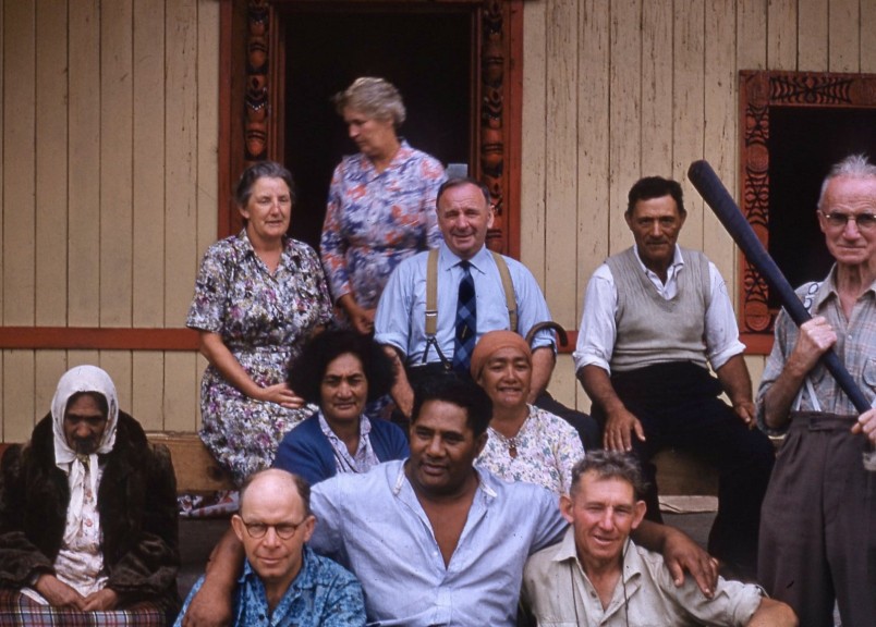 Ruatoki camp leaders, 1959: Bernard Teague (bottom right), Violet Rucroft (top left), Bessie Jarram (blue cardigan), and Alfred Morris-Jones (holding taiaha). Image Forest & Bird Archives