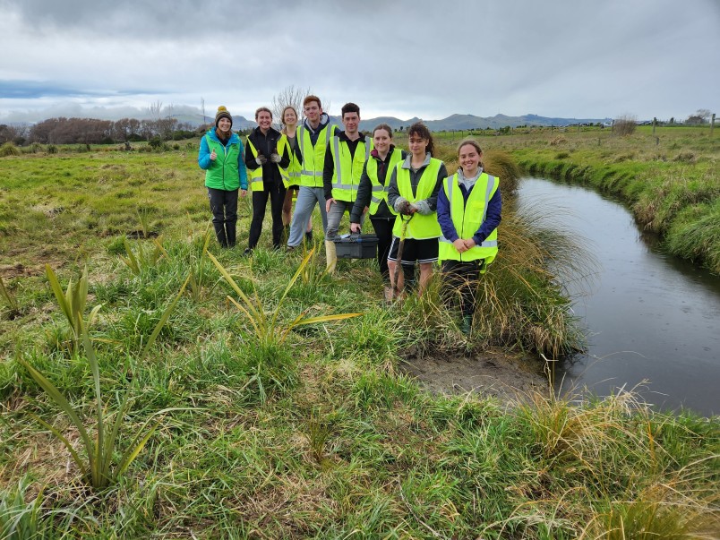 The Christchurch Youth Hub's restoration efforts in Mugford Reserve (with Ella at the front). Image supplied