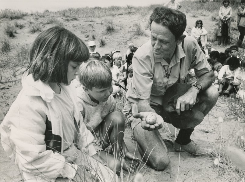 Former staffer and Distinguished Life Member Basil Graeme carrying out educational outreach, Ōhope Spit, 1990. Credit Whakatane Beacon